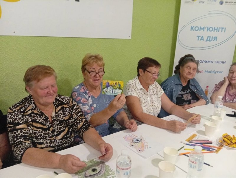 Participants sharing memories during a community event at Velyka Oleksandrivka Library
