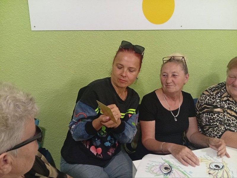 Participants discussing memories of youth during a library community meeting